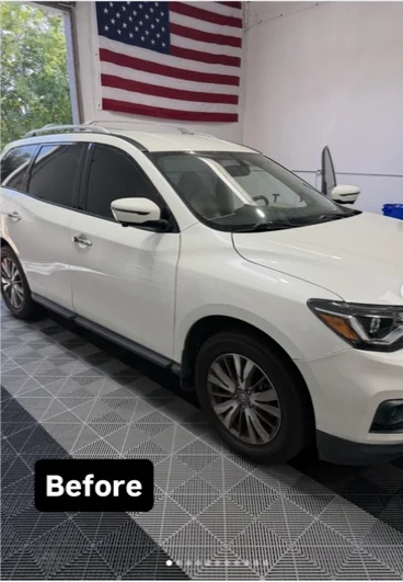 White SUV photographed before a window tint installation