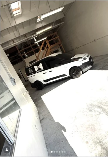 White roadster photographed in the shop